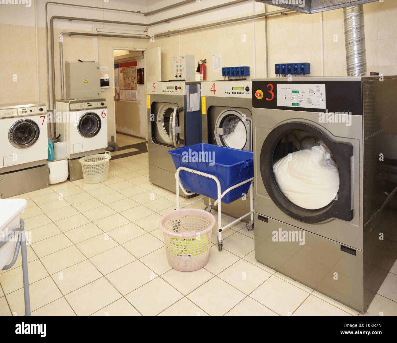 Commercial laundry interior shot in operation Stock Photo