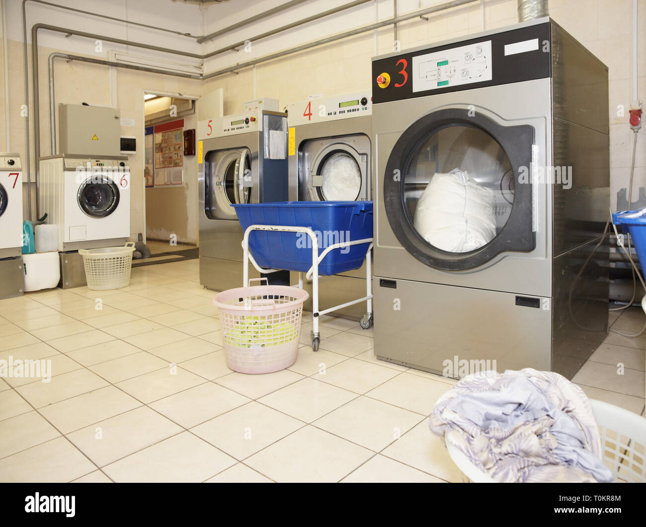 Commercial laundry interior shot in operation Stock Photo