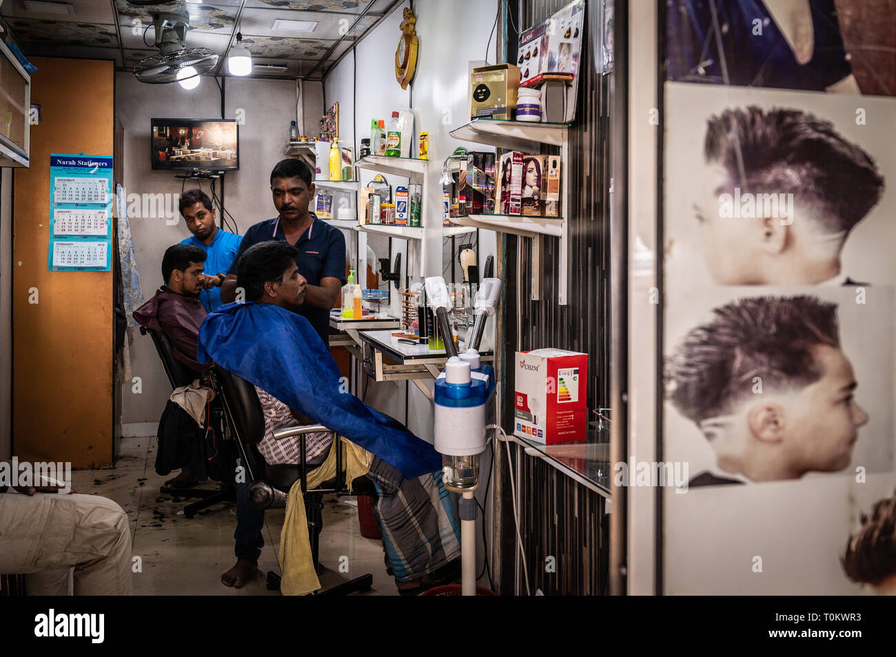 Barbers cutting hair in their shop, Colombo, Sri Lanka Stock Photo Alamy