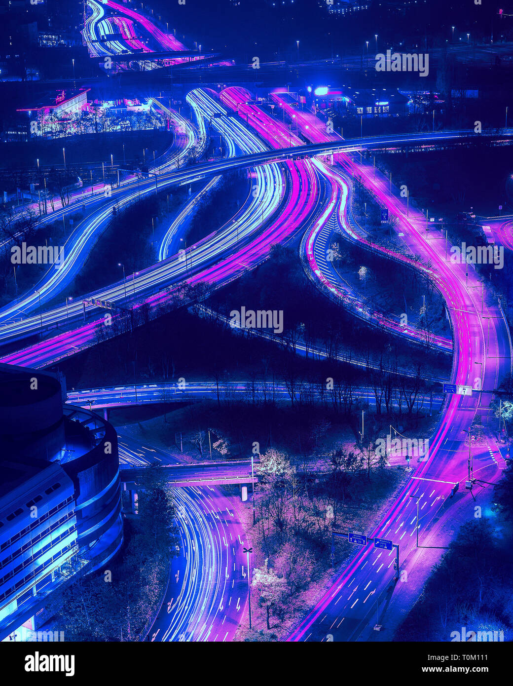 Berlin City Nightscape with traffic trails and neon lights. Stock Photo