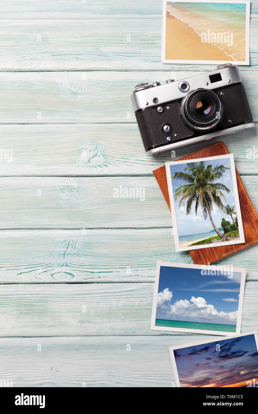 Travel vacation background concept with camera and weekend photos on wooden backdrop. Top view with copy space. Flat lay. All photos taken by me Stock Photo