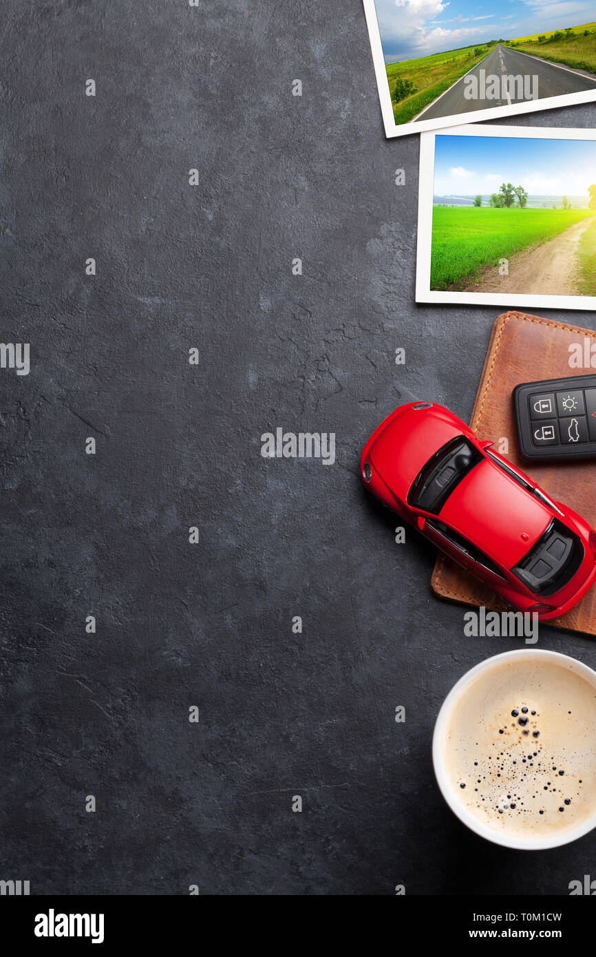 Travel vacation concept with passport, car toy and travel photos on stone backdrop. Top view with copy space. Flat lay. All photos taken by me Stock Photo