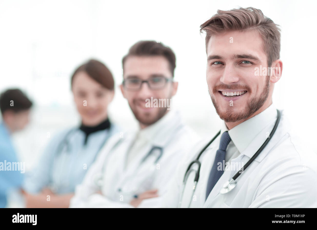 Portrait of friendly male doctor smiling Stock Photo - Alamy