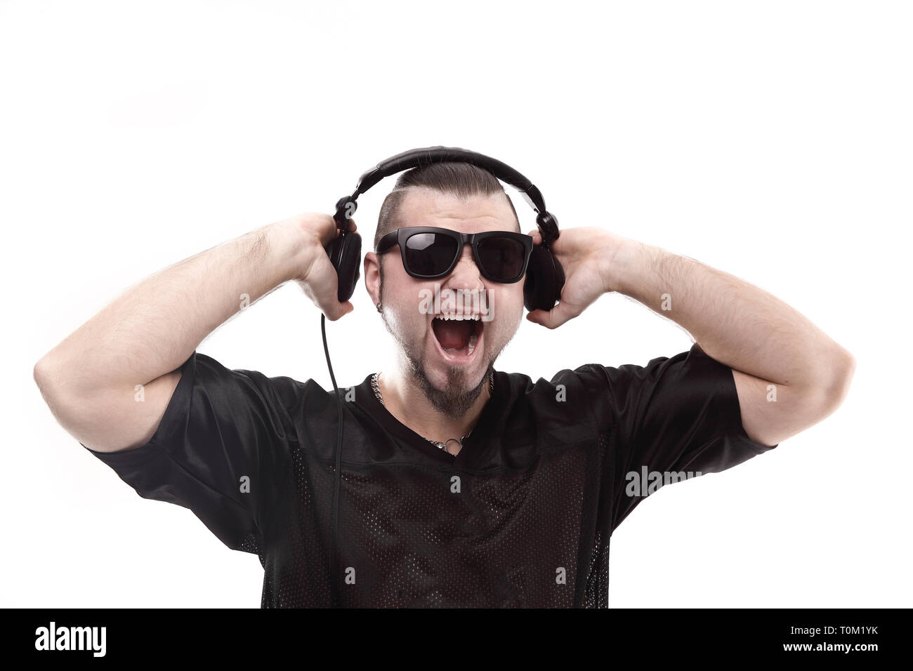 close up. stylish rapper shows headphones .isolated on white Stock ...