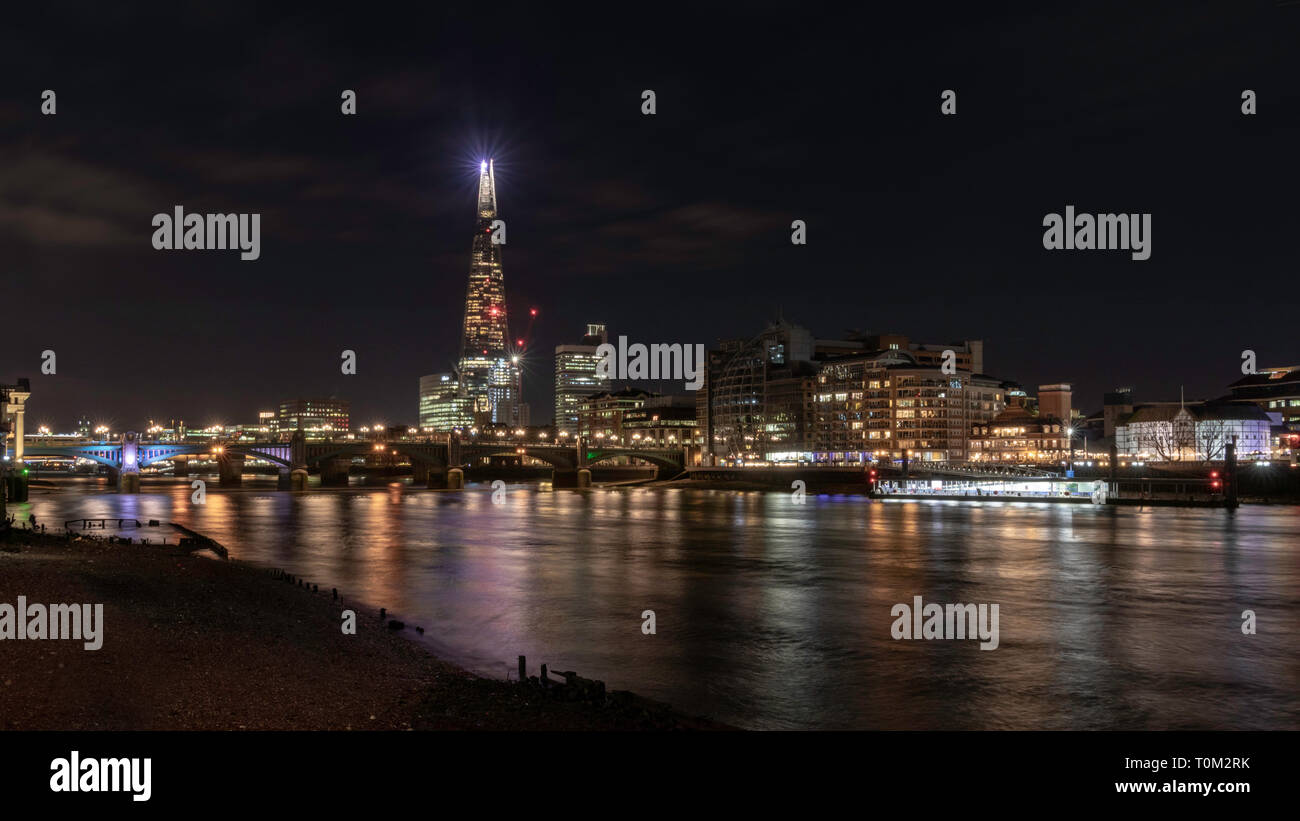 Night cityscape of London near Southbank bridge with Shard skyscraper