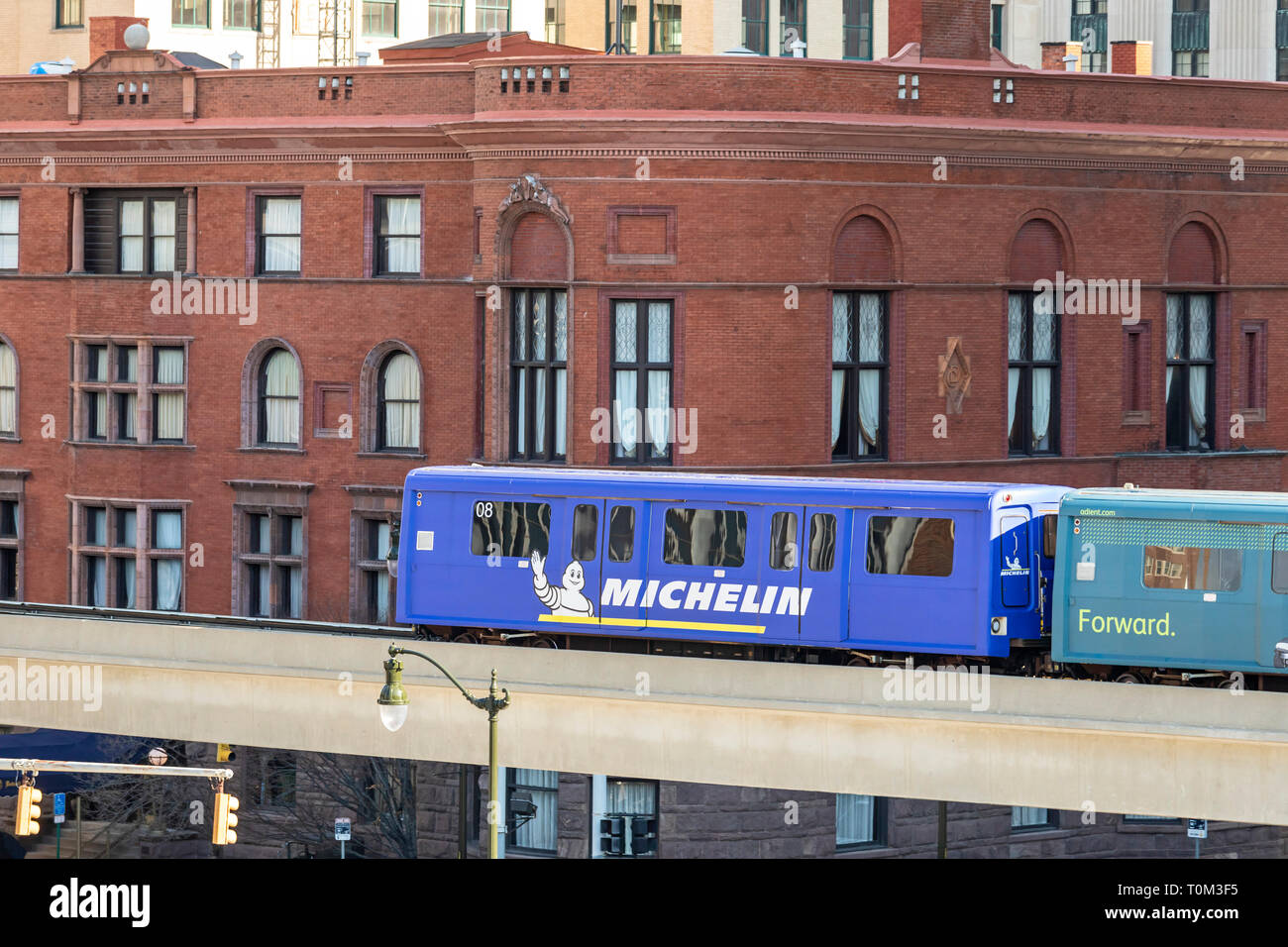 Detroit, Michigan - The People Mover, a three mile automated train which circles downtown on a single track. The train is shown passing the Detroit Cl Stock Photo