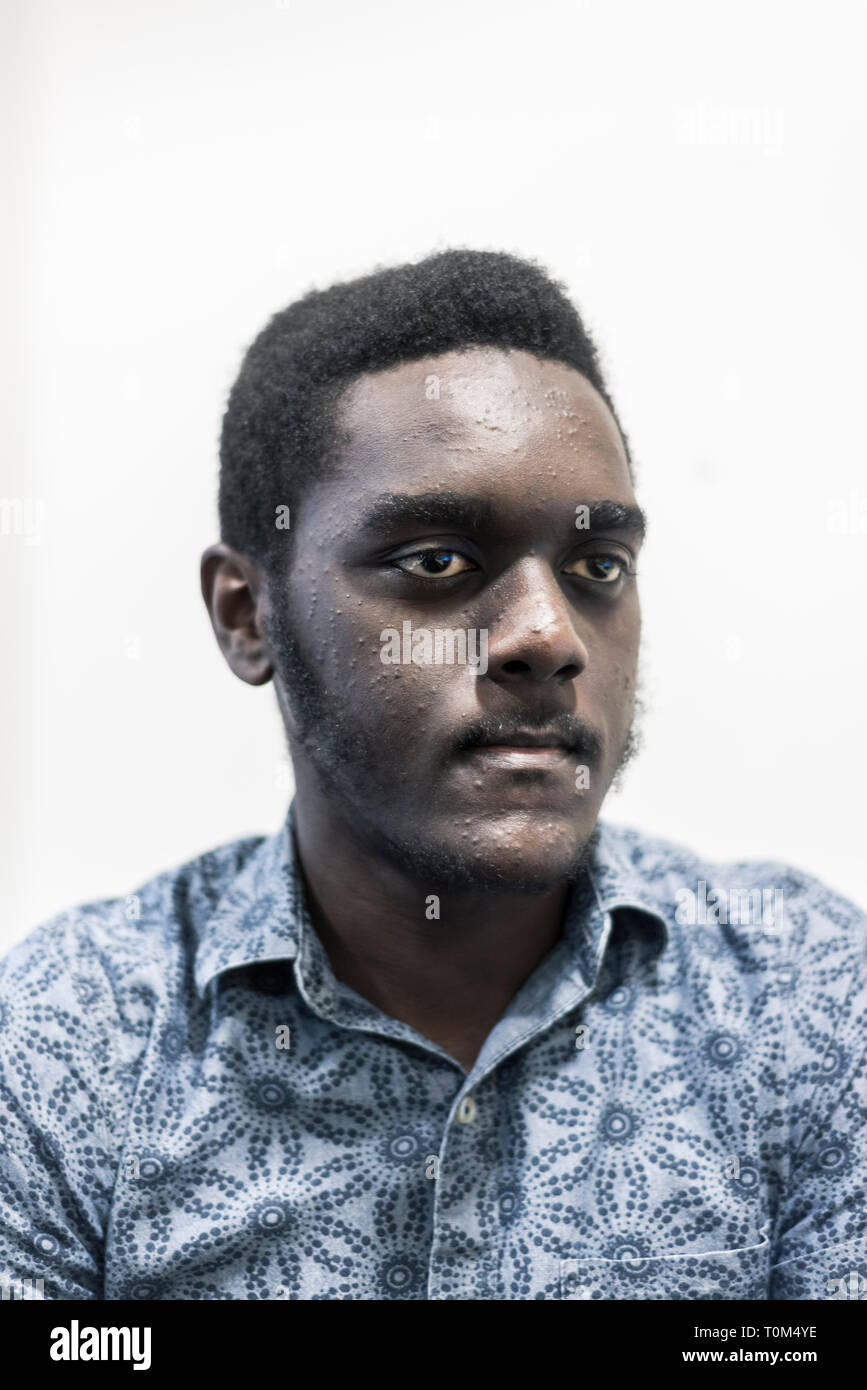 close up portrait of a young black man Stock Photo - Alamy