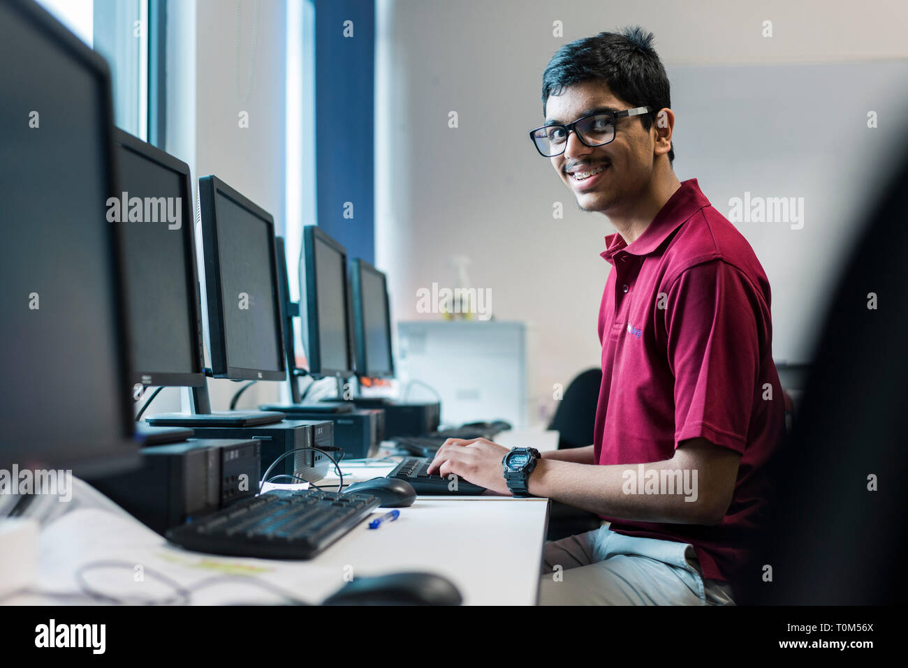 International Computer Students A young international student from the indian subcontinent works in the ...
