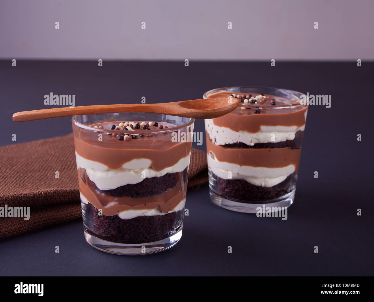 Chocolate dessert in glass jars on a black table Stock Photo Alamy