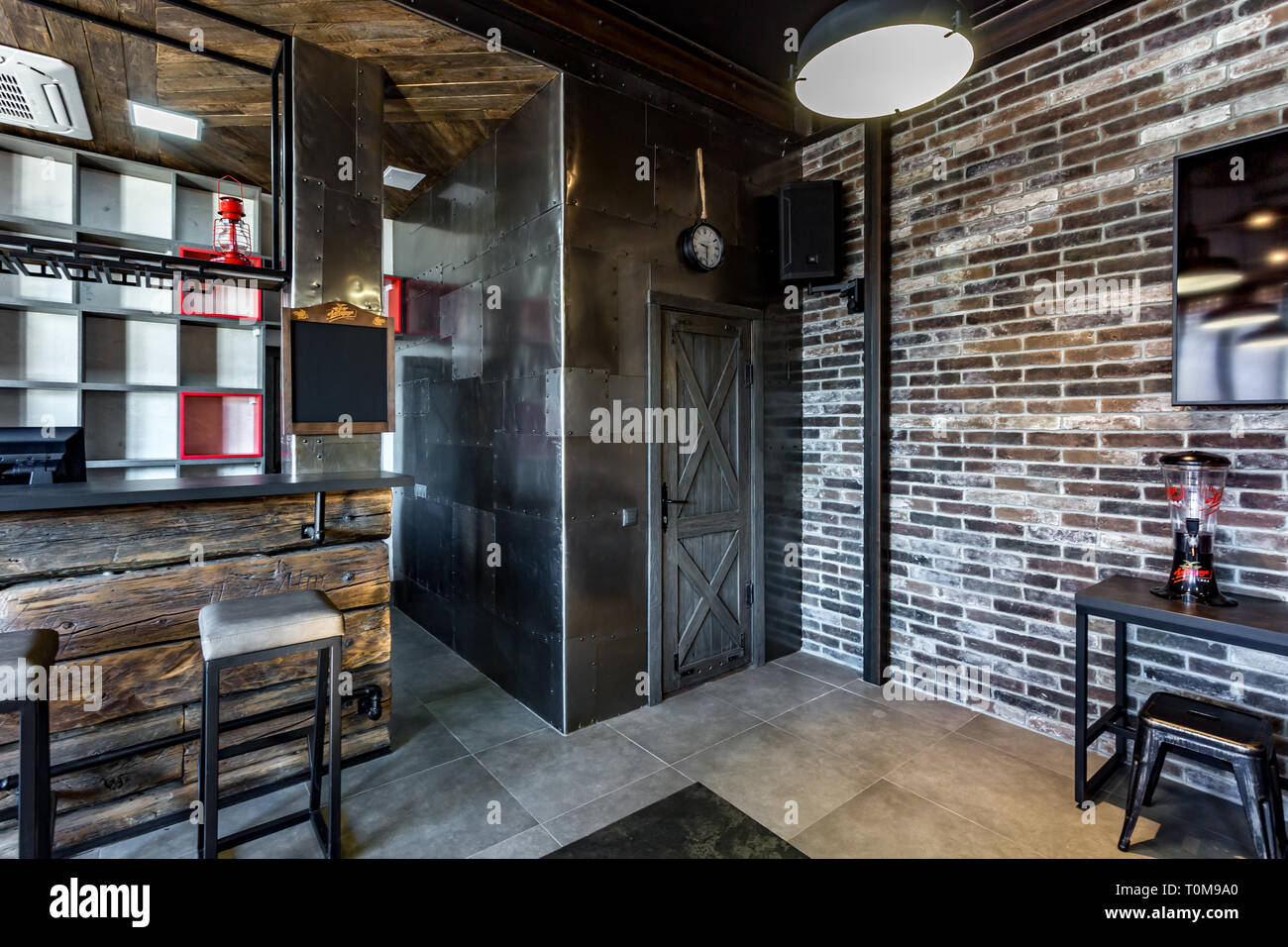 GRODNO, BELARUS - MARCH, 2019: inside interior in modern pub sport bar with  dark loft design style with red chairs Stock Photo - Alamy