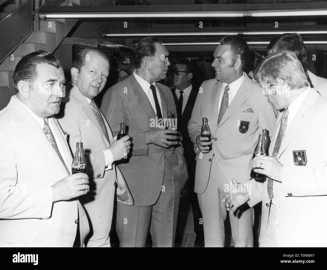 sports, football, functionaries, Germany, world championship in Mexico 1970, from left: Hans Deckert, vice president of the German Football Association Hermann Neuberger, Max Schmeling, Willi Huebner and Helmut Haller, press centre, Leon, 1970, Football World Cup, Soccer World Cup, World Football Championship, soccer world championship, FIFA World Cup, DFB, conversation, conversations, talks, talking, talk, speak, speaking, beverage, beverages, Coca Cola, bottles, bottle, suit, suits, clothes, 1970s, 70s, 20th century, people, group, groups, men,, Additional-Rights-Clearance-Info-Not-Available Stock Photo