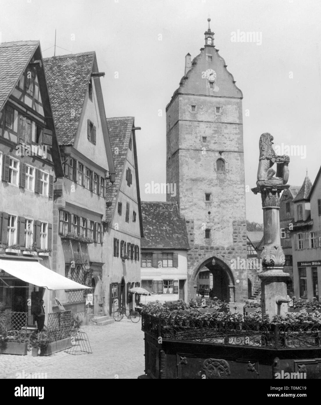 geography / travel, Germany, Dinkelsbuehl, fountains, Löwenbrunnen, behind it the Nuremberg Gate, June 1952, Additional-Rights-Clearance-Info-Not-Available Stock Photo