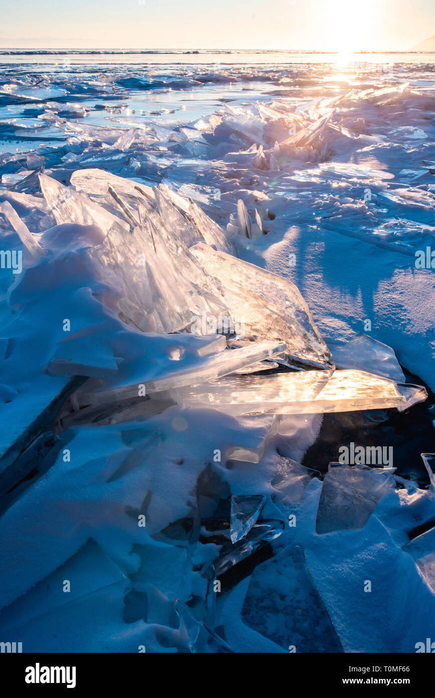 Ice pieces and ice sculptures at sunset on Lake Baikal, Siberia, Russia Stock Photo