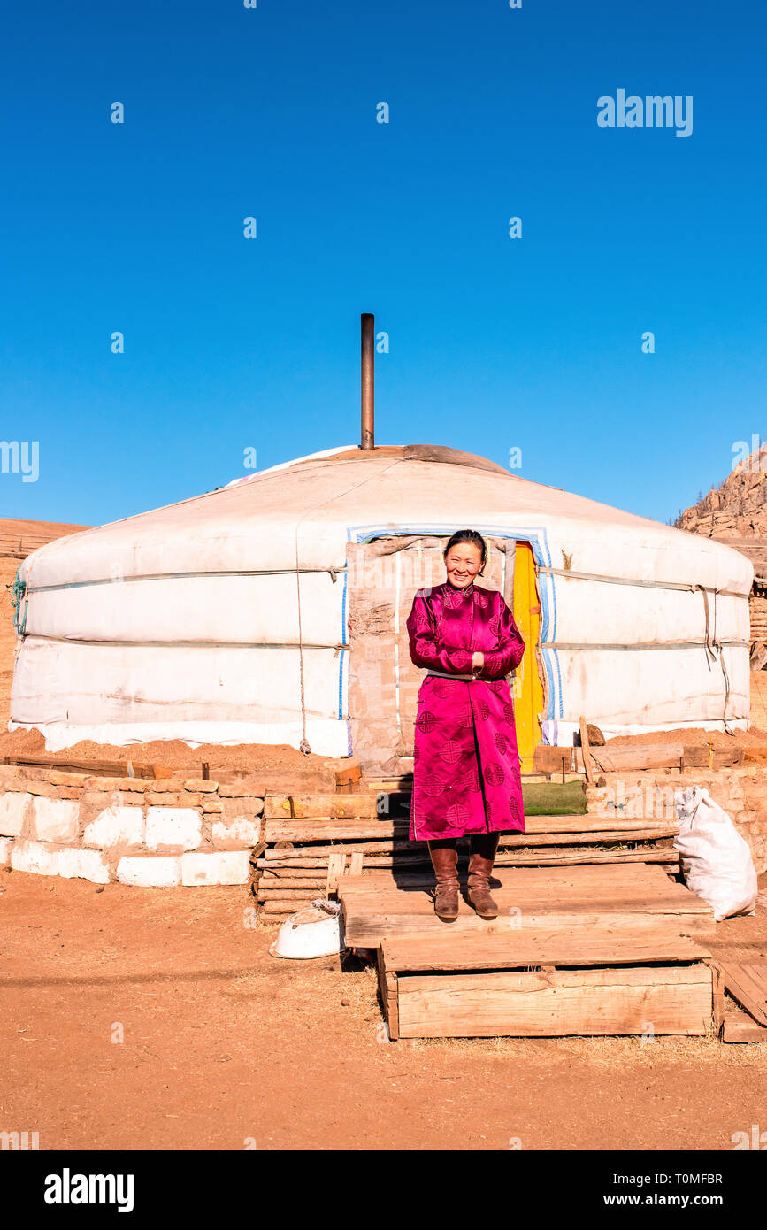 Nomadin in front of yurt in Mongolia Stock Photo