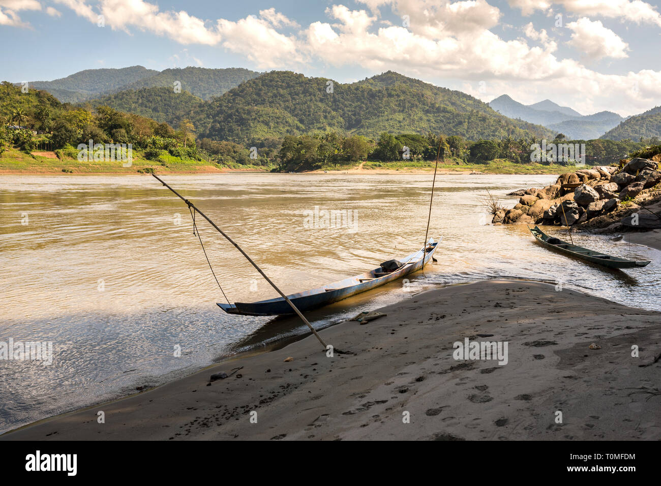 Small boat on the banks of the Mekong, Laos Stock Photo
