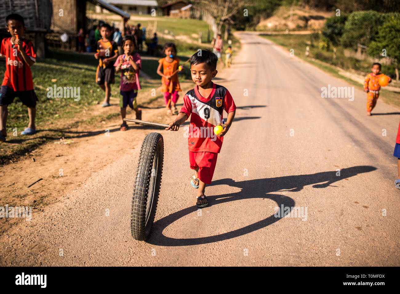 Playing children in a village in Laos Stock Photo