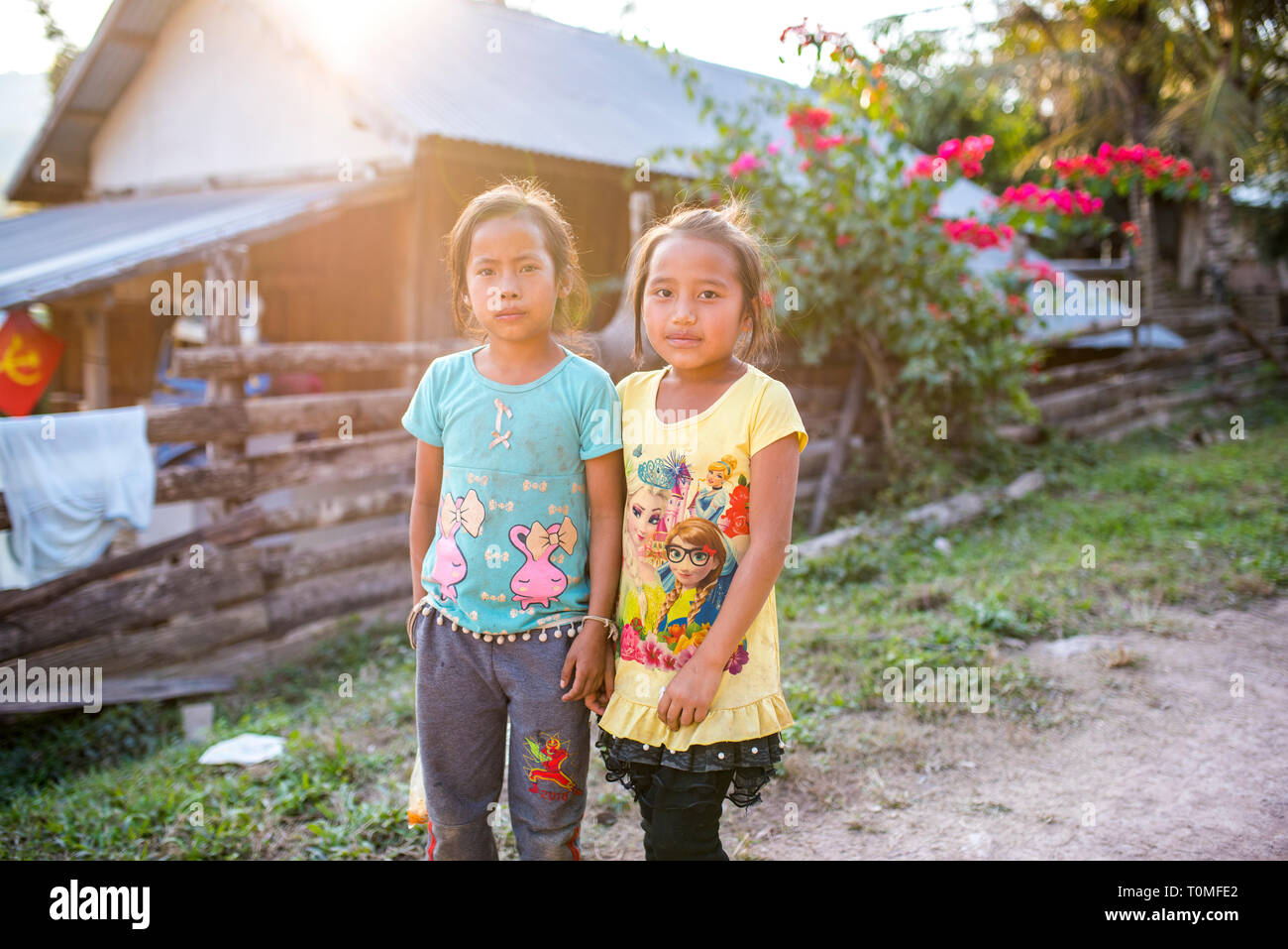 Two Laotian girls in a village in Laos Stock Photo