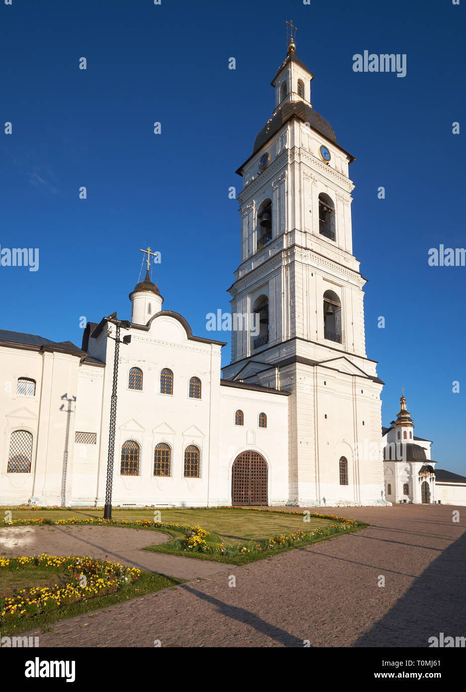 The view of the tall neoclassical bell tower and church sacristy of Tobolsk Kremlin. Tobolsk. Russia Stock Photo