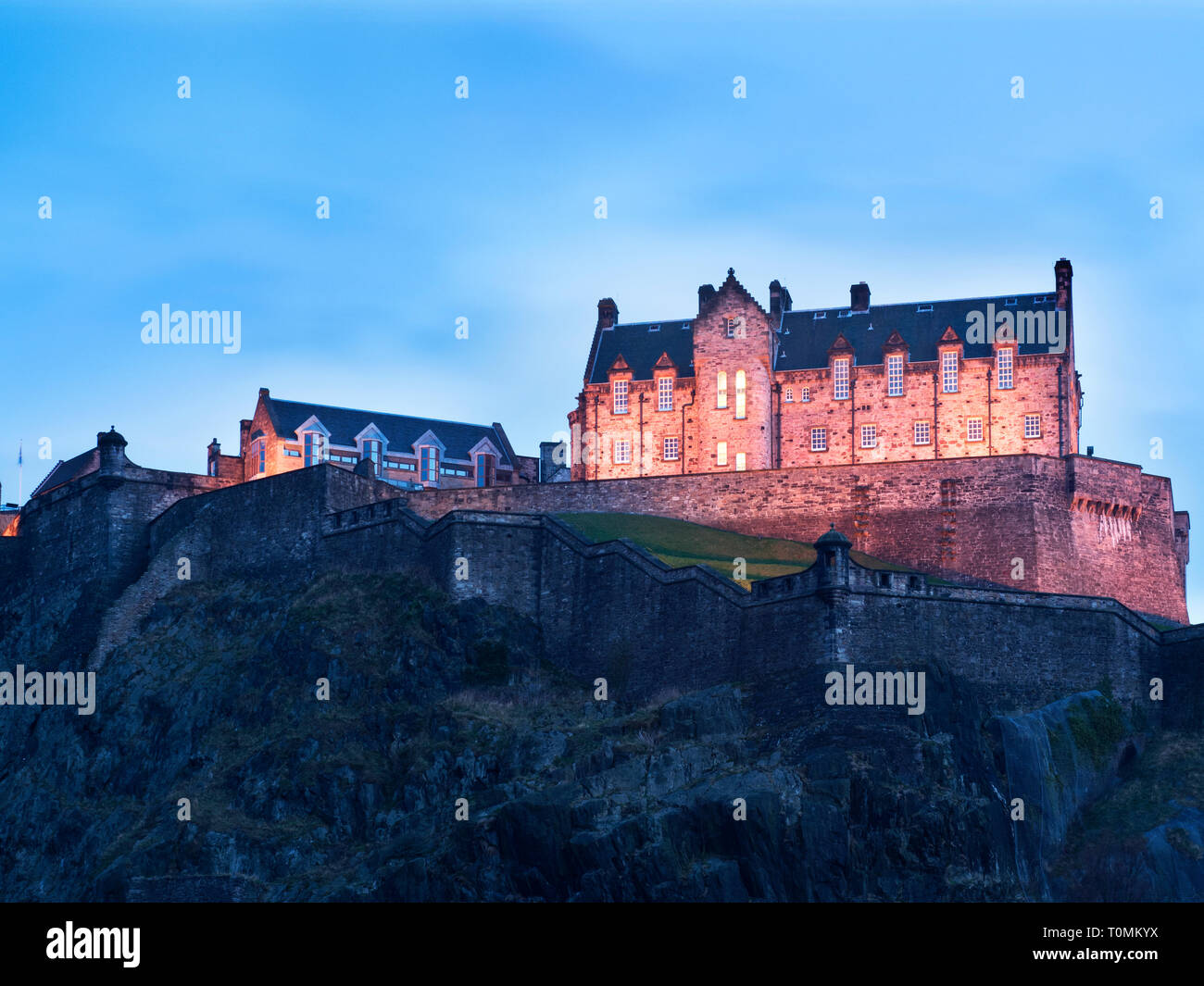 Edinburgh Castle floodlit at dusk from Princes Street Gardens Edinburgh
