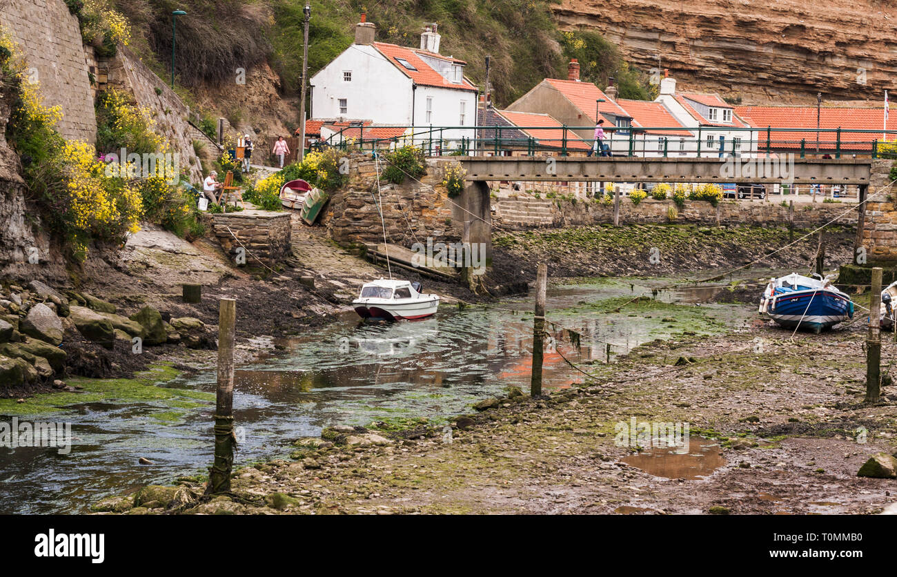 Two Female Artists Painting The Landscape At Roxby Beck Staithes