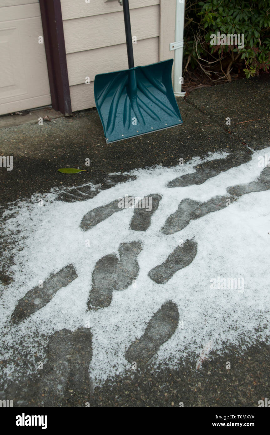 Footprints on a walkway after a fresh fallen snow in Monroe,Washington. Stock Photo