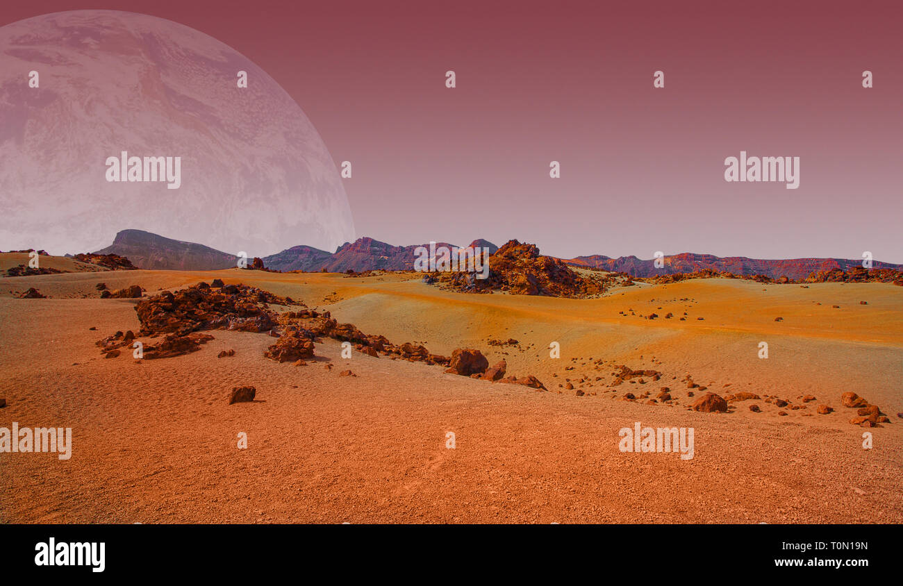Red planet with arid landscape, rocky hills and mountains, and a giant Mars-like moon at the horizon, for space exploration and science fiction backgr Stock Photo