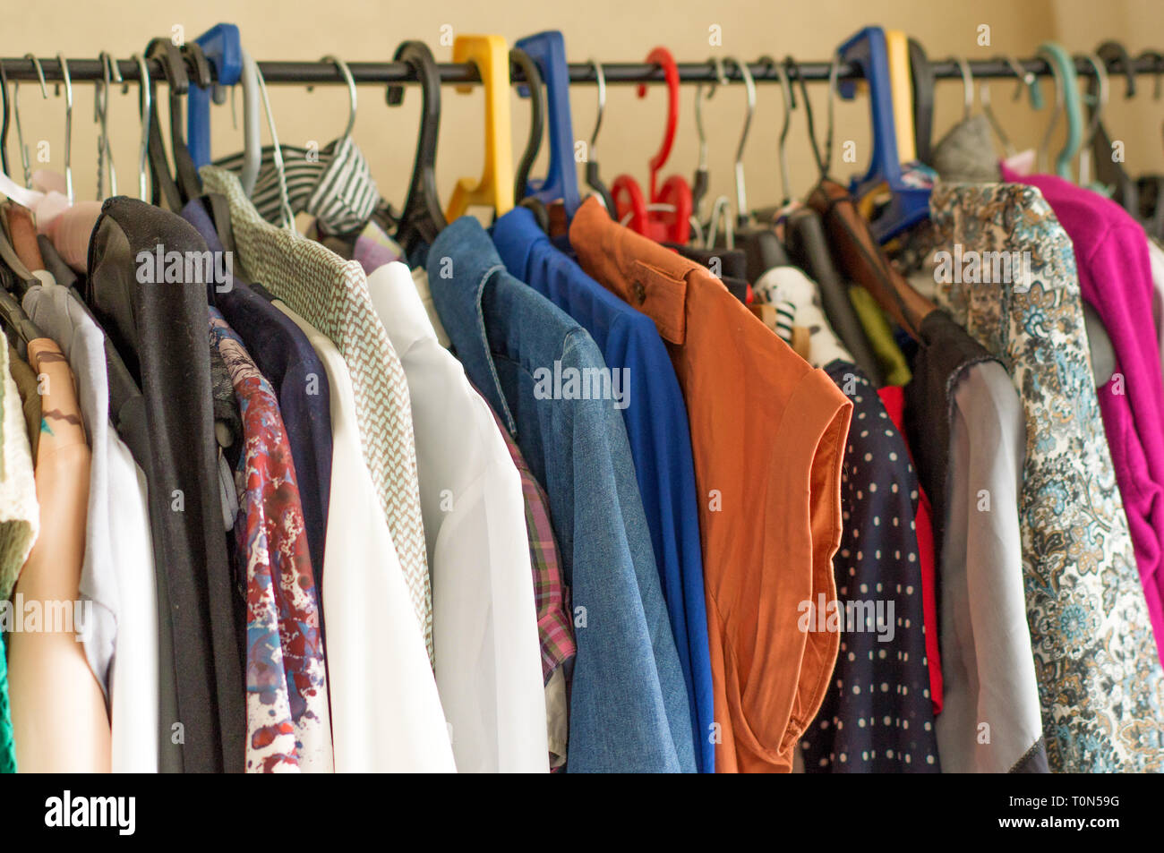 Fashion Clothes On Clothing Rack Bright Colorful Closet Closeup