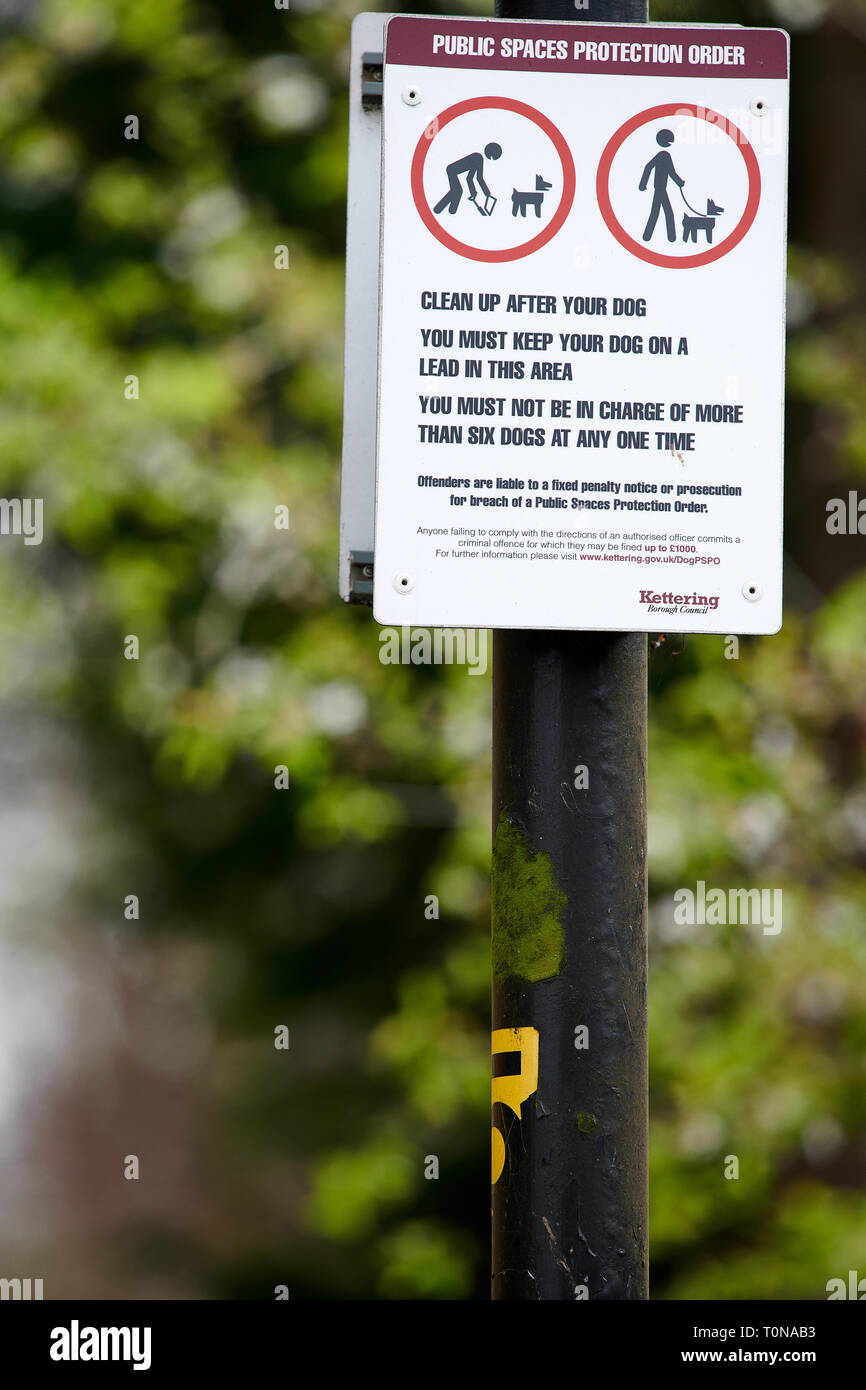 Signs advising dog walkers that the area is a public space under a protection order. Stock Photo