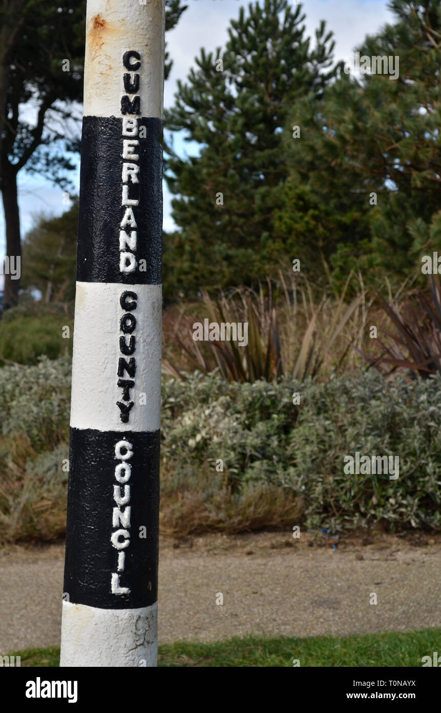 Detail of old sign pole with the raised letters of Cumberland County Council, at Silloth