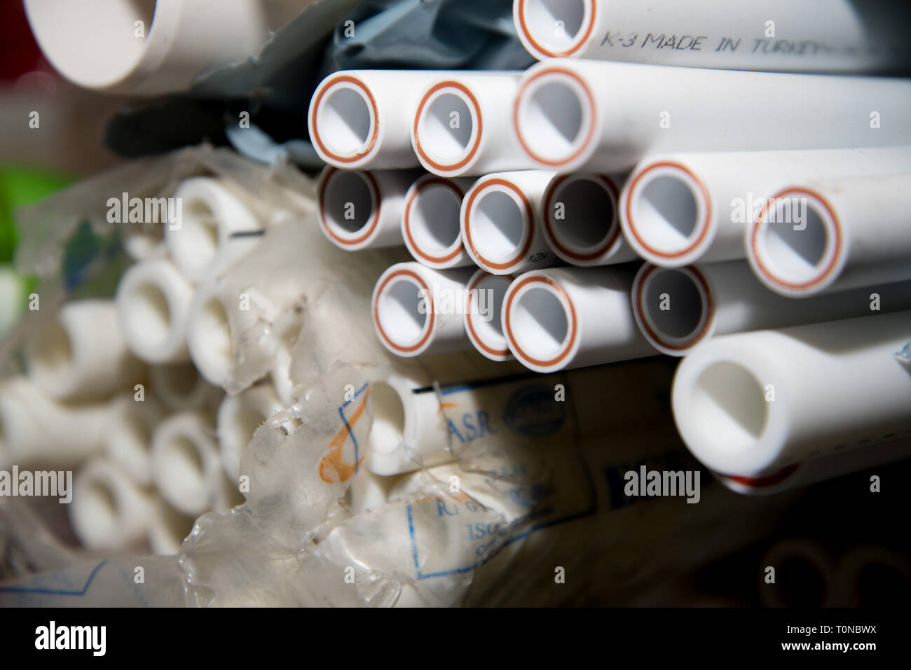 Chelyabinsk region, Russia - February 2019. Plumbing workshop. Rack with goods. Warehouse of polypropylene pipes. Natural look Stock Photo