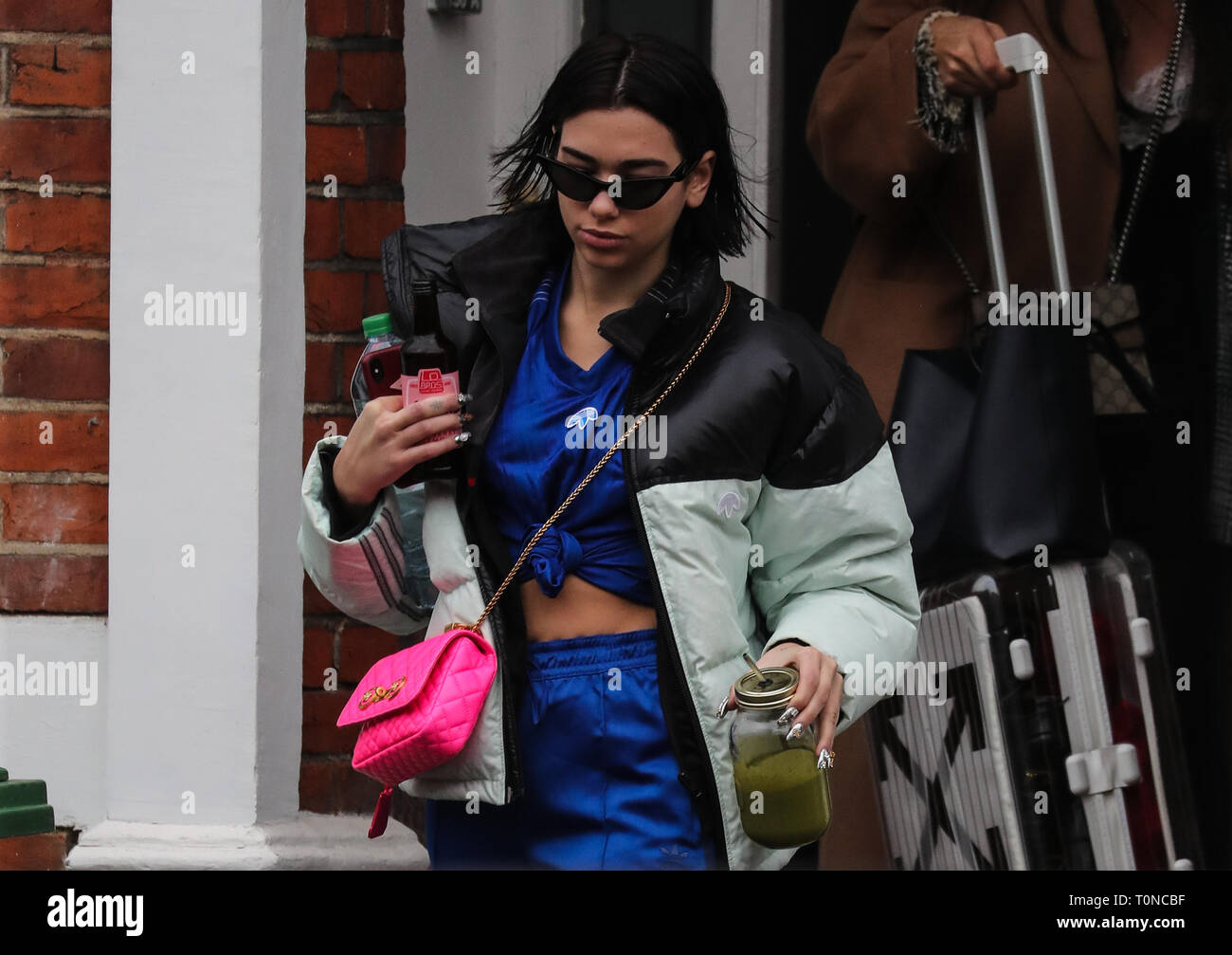 Dua Lipa leaves her London home wearing an adidas tracksuit and carrying a  smoothie Featuring: Dua Lipa Where: London, United Kingdom When: 18 Feb  2019 Credit: WENN.com Stock Photo - Alamy