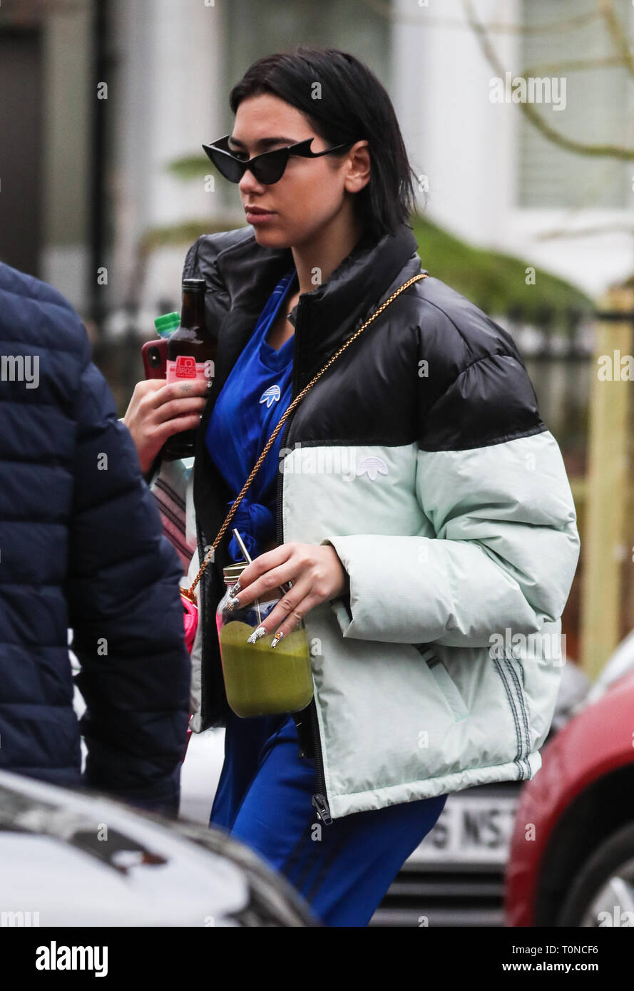 Dua Lipa leaves her London home wearing an adidas tracksuit and carrying a  smoothie Featuring: Dua Lipa Where: London, United Kingdom When: 18 Feb  2019 Credit: WENN.com Stock Photo - Alamy