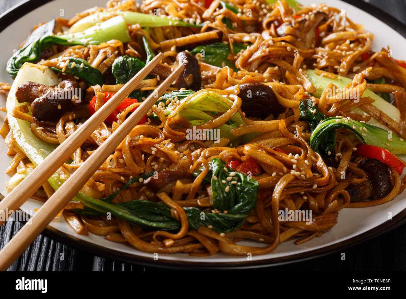 Traditional stir fry of udon noodles with bok choy, shiitake mushrooms