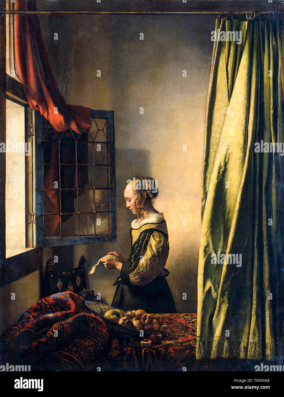 Johannes Vermeer, Girl Reading a Letter at an Open Window, Baroque painting, circa 1659 Stock Photo