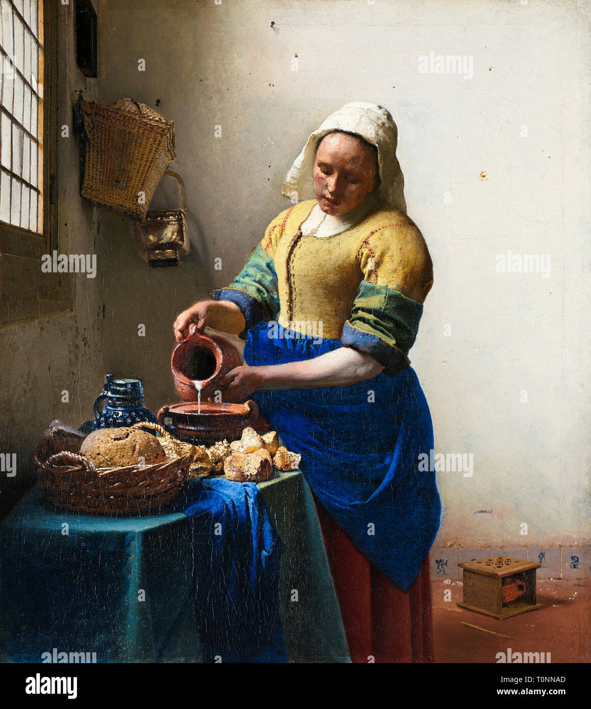 Johannes Vermeer, The Milkmaid, Baroque painting, circa 1660 Stock Photo