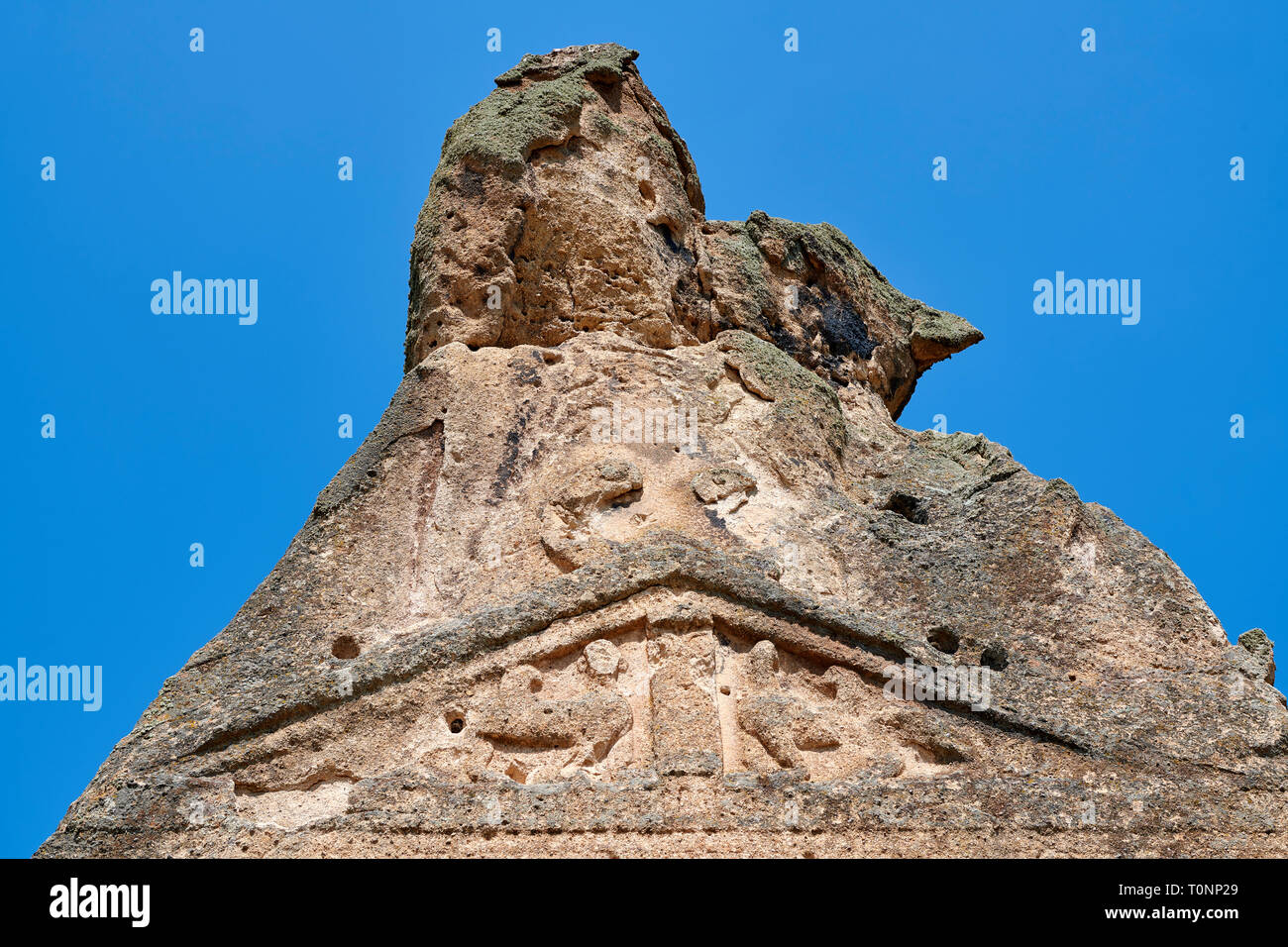Close up of two sphinxes relief scul[ptures of the Phrygian temple of Aslankaya, 7th century BC. Phyrigian Valley, Emre Lake, near Döğer, Turkey.  On  Stock Photo