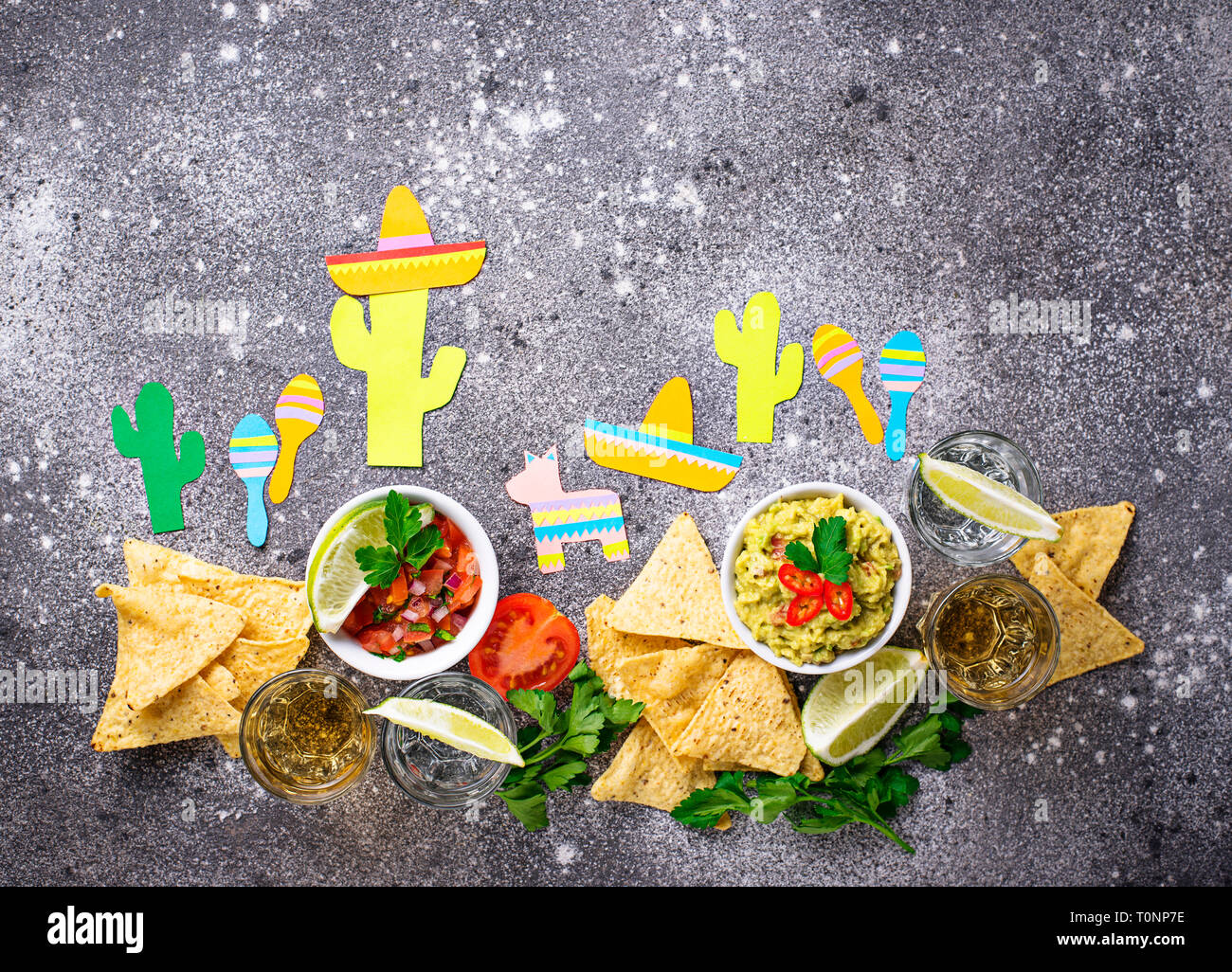 Guacamole, salsa, nachos and tequila Stock Photo Alamy