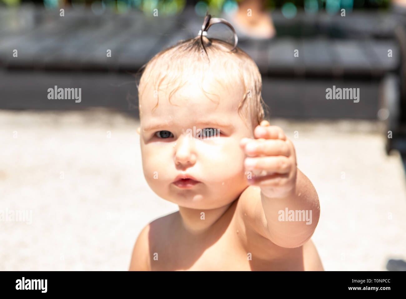 little baby girl one year old pulls hand Stock Photo Alamy