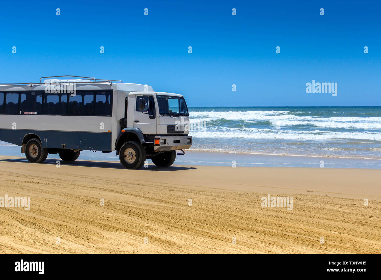 bus trip on beach road higway in fraser island, travel australia adventure Stock Photo
