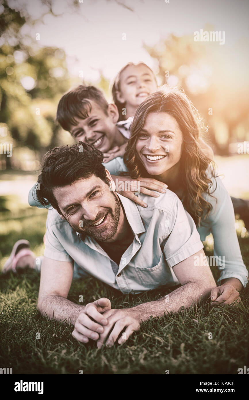 Portrait of happy family playing in park Stock Photo