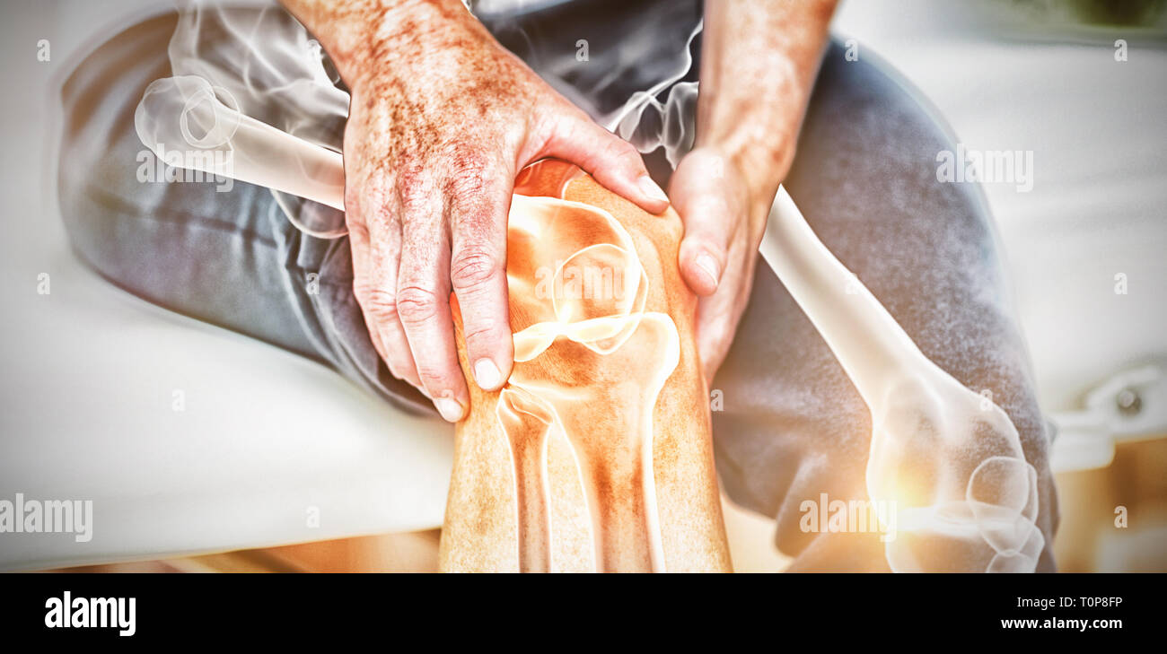 Mid section of man suffering with knee pain Stock Photo