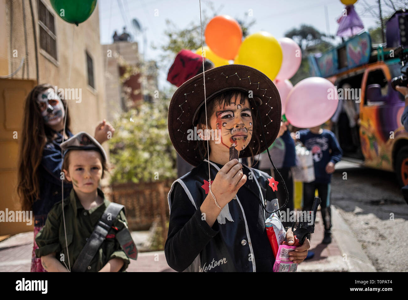 Jewish children celebrating Purim in fancy dress, take to the streets to  sing and dance or just parade in their costumes Stock Photo - Alamy