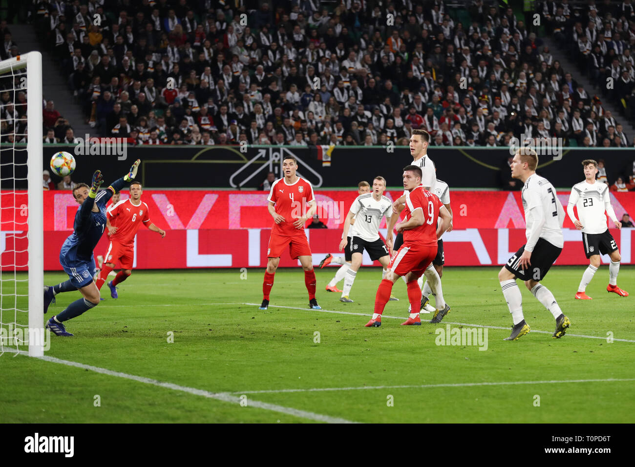 20 March 2019, Lower Saxony, Wolfsburg: Soccer: International match, Germany - Serbia in the Volkswagen Arena. Luka Jovic (3rd from right) from Serbia scores the goal for 0:1 against Germany's goalkeeper Manuel Neuer (left). Photo: Christian Charisius/dpa Stock Photo