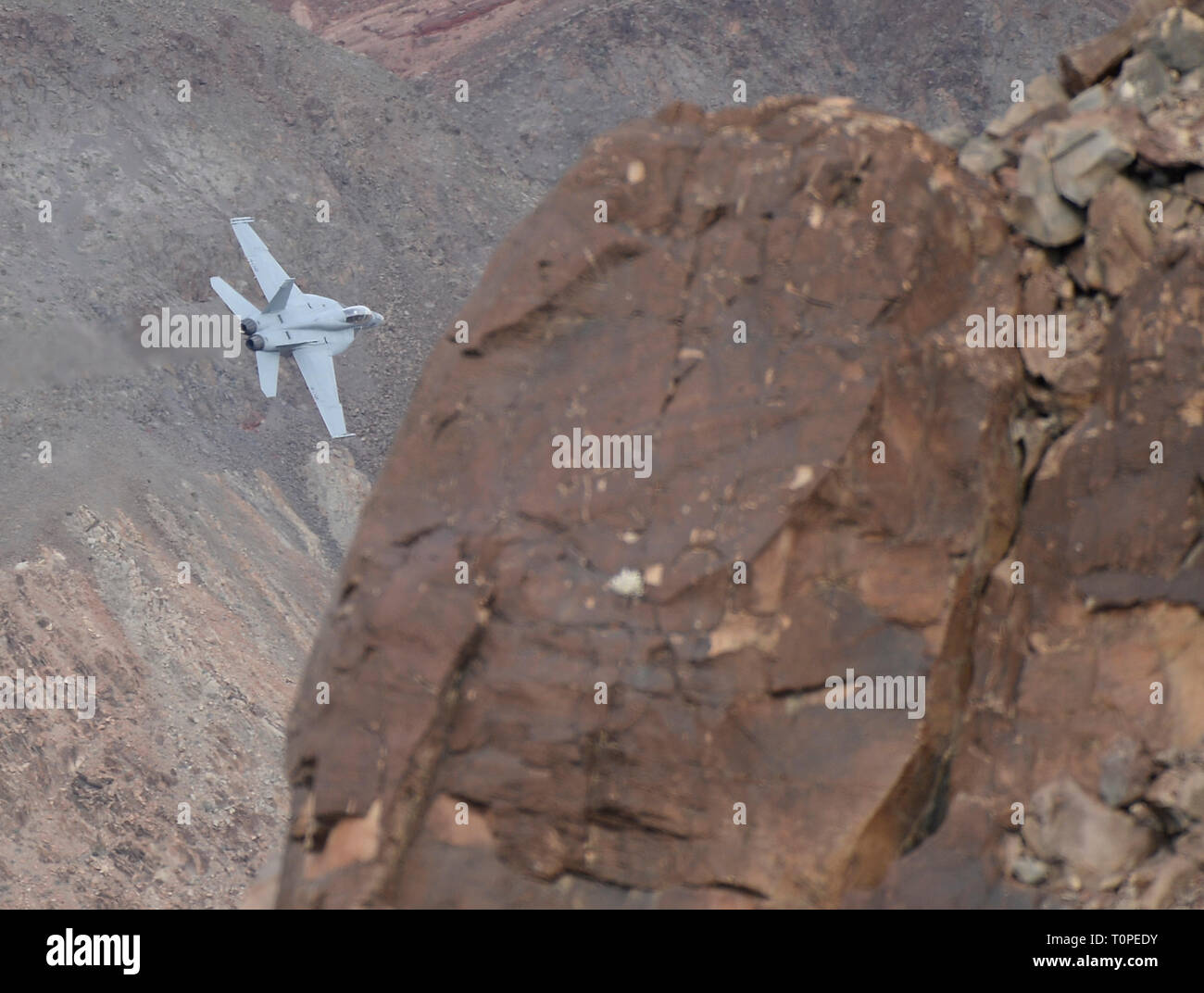 F-18 makes a high speed pass up to 500 mph through Rainbow/StarWars Canyon the Jedi Transition in Panamint Spring/ Death Valley Monday/Tuesday. Many different kinds of jet fighters practice their low flying attack runs during Red-Flag operations this month, March 18-19, 2019. Photo by Gene Blevins/ZumaPress. Credit: Gene Blevins/ZUMA Wire/Alamy Live News Stock Photo