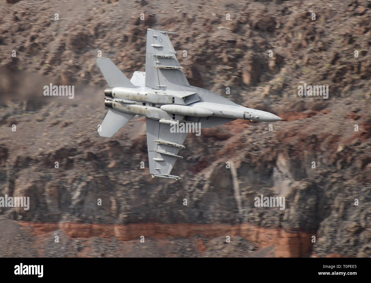 F-18 makes a high speed pass up to 500 mph through Rainbow/StarWars Canyon the Jedi Transition in Panamint Spring/ Death Valley Monday/Tuesday. Many different kinds of jet fighters practice their low flying attack runs during Red-Flag operations this month, March 18-19, 2019. Photo by Gene Blevins/ZumaPress. Credit: Gene Blevins/ZUMA Wire/Alamy Live News Stock Photo