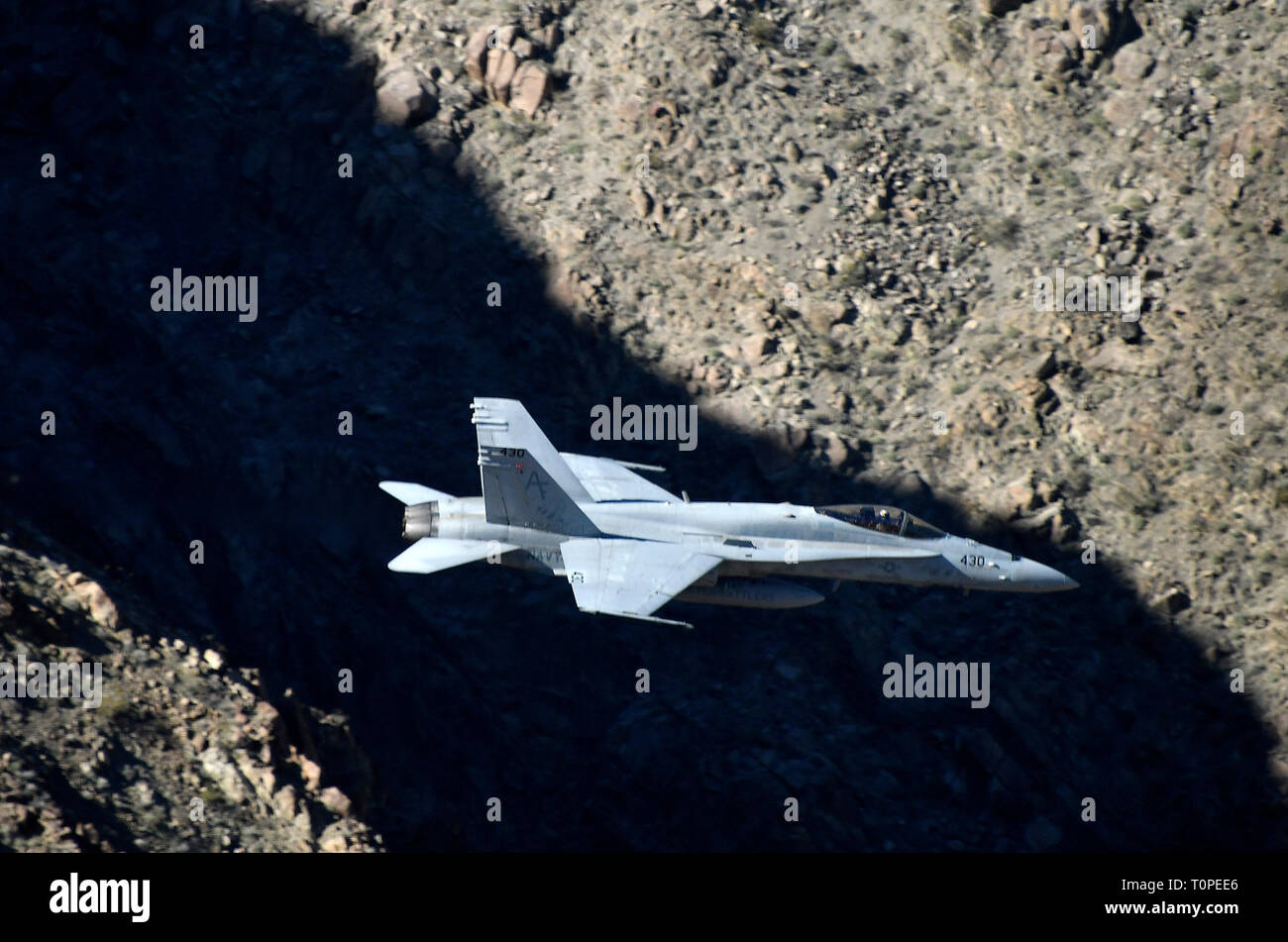 F-18 makes a high speed pass up to 500 mph through Rainbow/StarWars Canyon the Jedi Transition in Panamint Spring/ Death Valley Monday/Tuesday. Many different kinds of jet fighters practice their low flying attack runs during Red-Flag operations this month, March 18-19, 2019. Photo by Gene Blevins/ZumaPress. Credit: Gene Blevins/ZUMA Wire/Alamy Live News Stock Photo