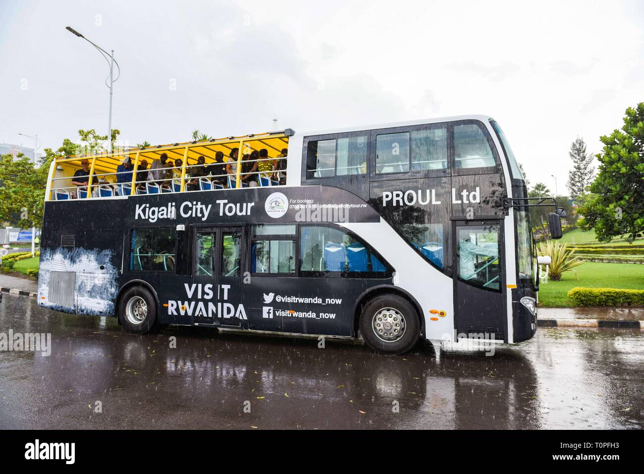 Kigali, Rwanda. 21st Mar, 2019. Kigali's first double-decker tour bus carries passengers in a city tour following its unveiling ceremony in Kigali, capital of Rwanda, on March 21, 2019. Rwanda Development Board in collaboration with Kigali City Tour Limited, a private company, on Thursday unveiled Kigali's first double-decker tour bus, which will be used for sightseeing in the city. Credit: Cyril Ndegeya/Xinhua/Alamy Live News Stock Photo