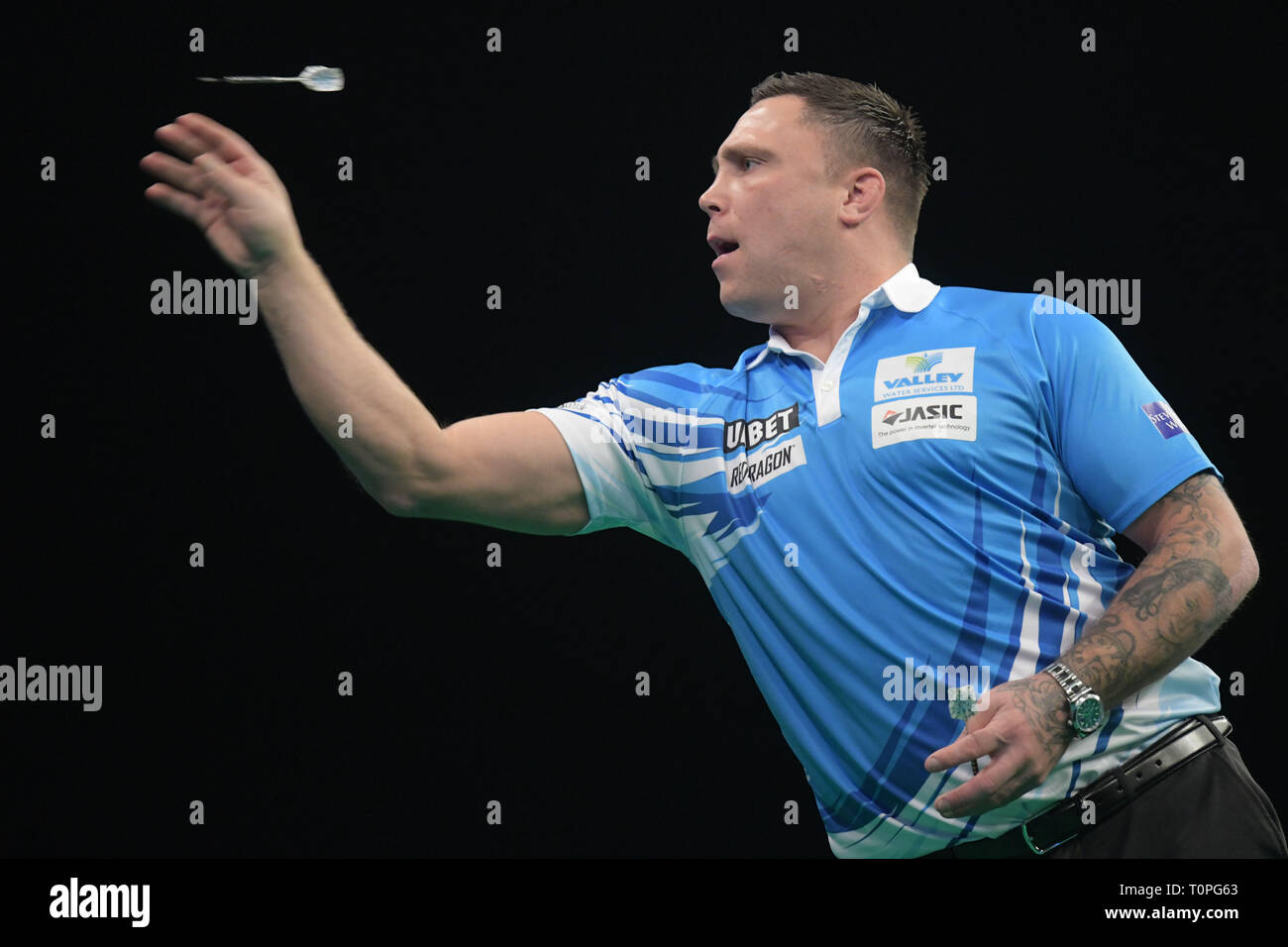March 2019, Berlin: Welsh professional Gerwyn Price is in action at the Premier League in the sold-out arena at Ostbahnhof. Photo: Jörg Carstensen/dpa Stock Photo - Alamy