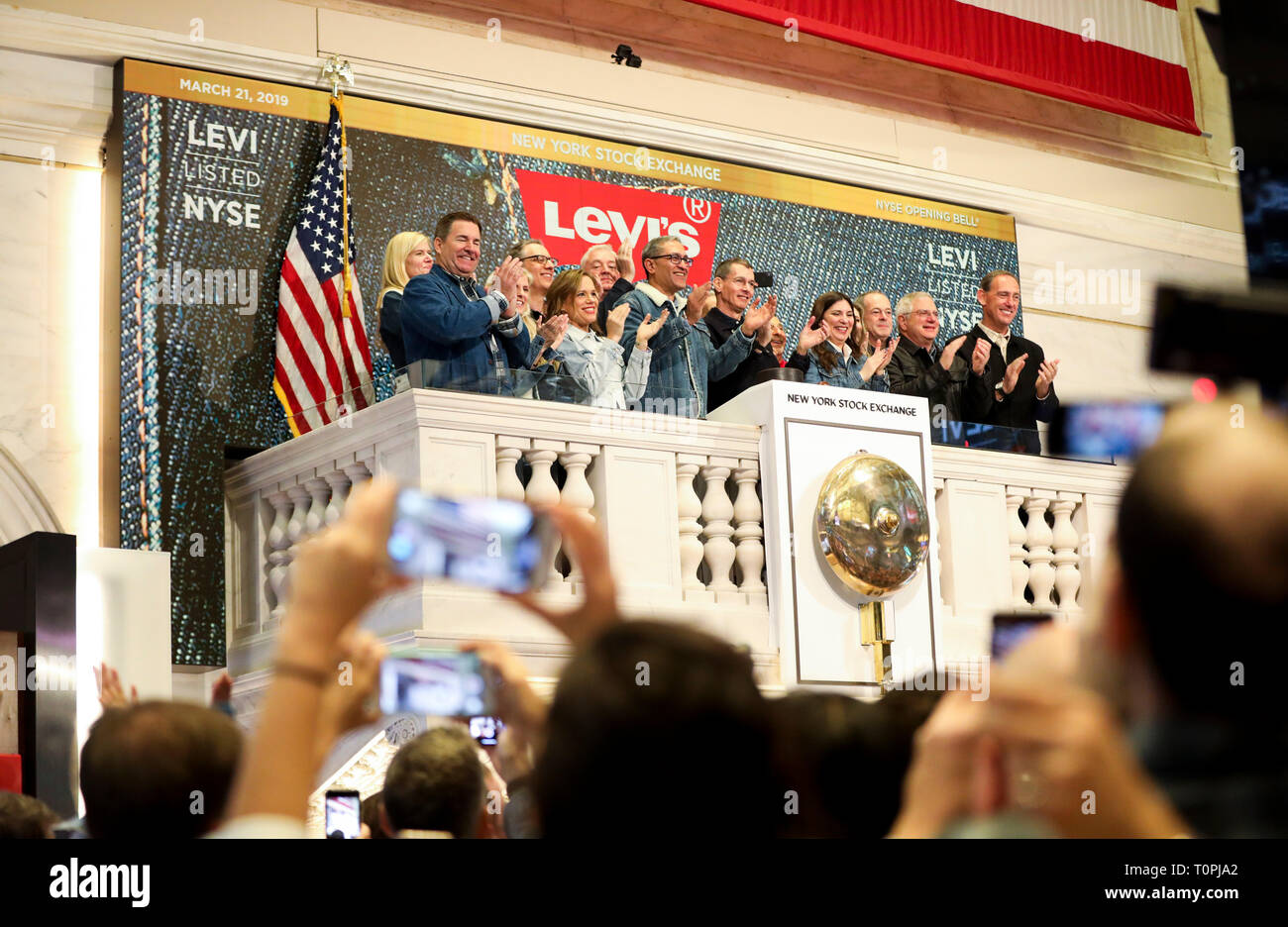 New York, USA. 21st Mar, 2019. Invited guests ring the opening bell to mark the initial public offering (IPO) of Levi Strauss & Co. at the New York Stock Exchange (NYSE) in New York, the United States, March 21, 2019. Blue jeans giant Levi Strauss & Co. began trading on the NYSE on Thurday. The 166-year-old company first went public in 1971, but has been private for the last 34 years. Credit: Wang Ying/Xinhua/Alamy Live News Stock Photo
