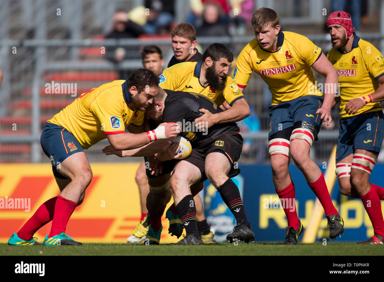 17 March 2019, North Rhine-Westphalia, Köln: Felix Martel (Germany) is held  by Manu Mora (Spain, 8) and pulled to the ground. Fifth match of the Rugby  Europe Championship 2019: Germany-Spain on 17.03.2019